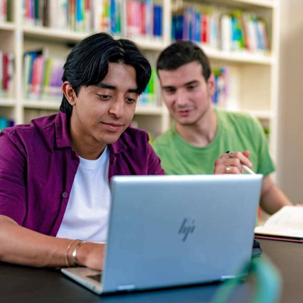 International students Diego and Andrei studying at the library on the Arnhem campus of HAN University of Applied Sciences.